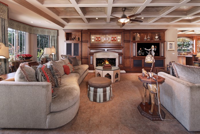 Living room with coffered ceiling and fireplace