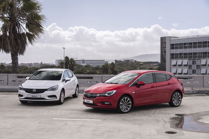Two Opel Astra cars parked outdoors