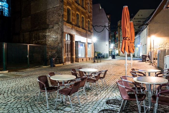 Outdoor cafe tables and chairs at night in Zwickau, Germany