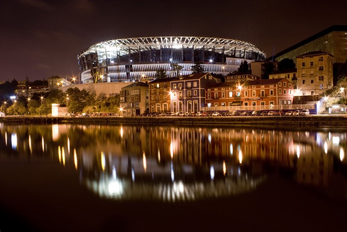 Night view of Olabeaga, Bilbao, Spain with stadium and river