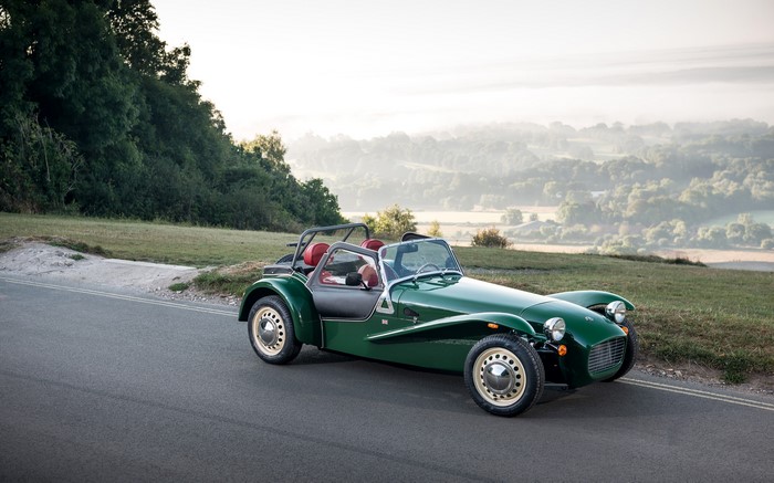 Green Caterham 7 Sprint car on a road