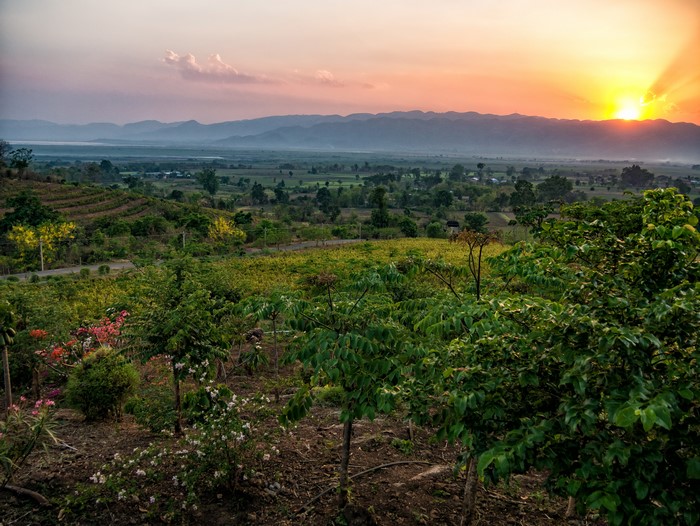 Sunset over fields and mountains in Myanmar