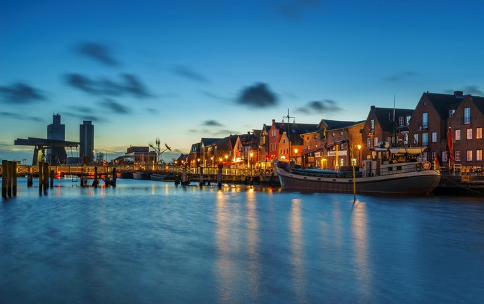 Evening view of Husum harbor with boats and buildings