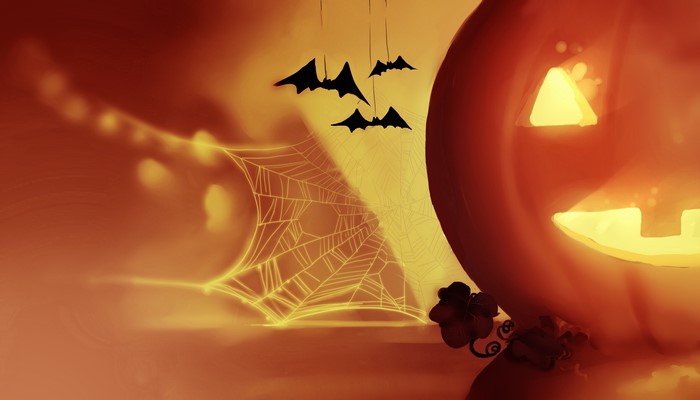 Halloween pumpkin with bats and spider web