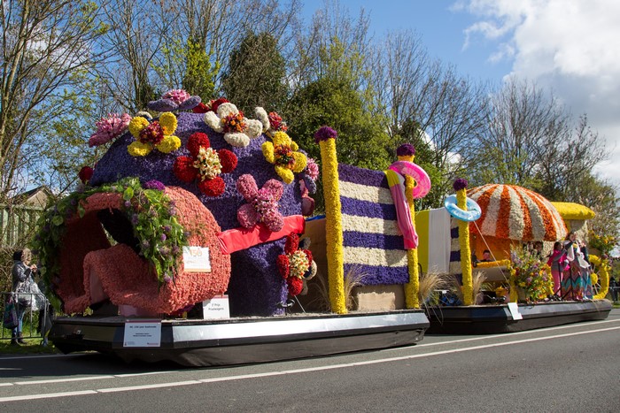 Flower Parade Float with People and Flowers