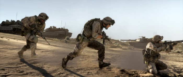 Soldiers running with tanks on a battlefield