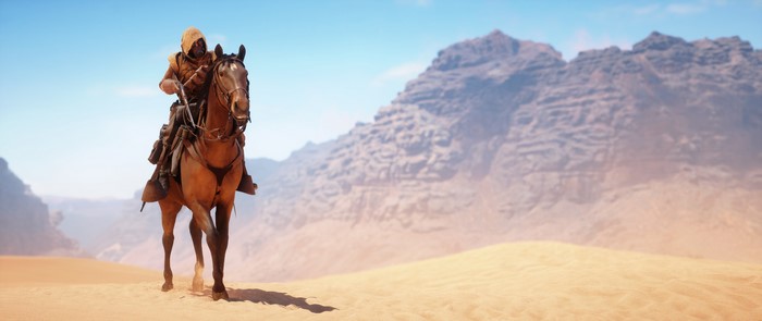 Soldier on horseback in desert with mountains