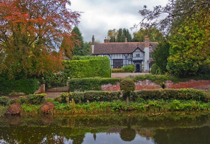 Tudor-style house with a pond in Gawsworth, Cheshire, England