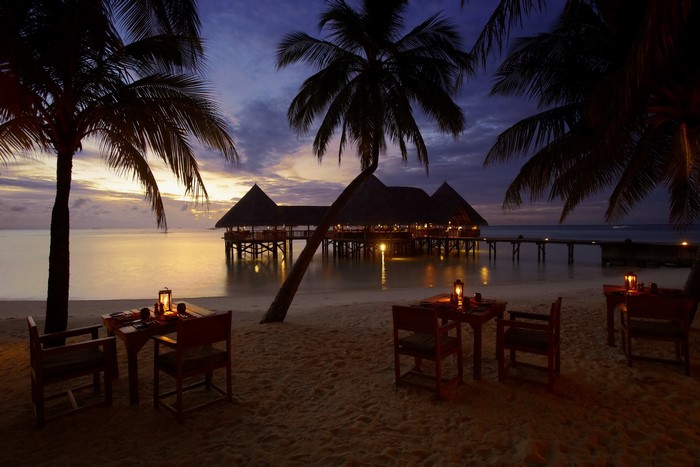 Beachside dining at Gili Lankanfushi, Maldives at dusk