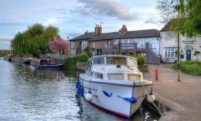 Motorboat docked on canal in Ely, Cambridgeshire, United Kingdom