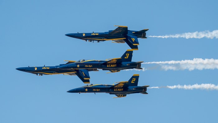 Blue Angels FA-18 fighter jets flying in formation