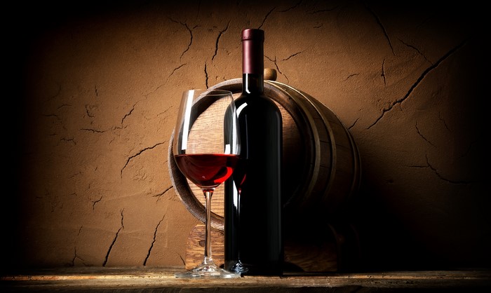 Bottle of Wine and Glass with Barrel