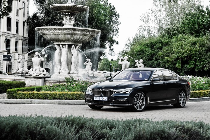 Black BMW 7-Series G11 Sedan near fountain