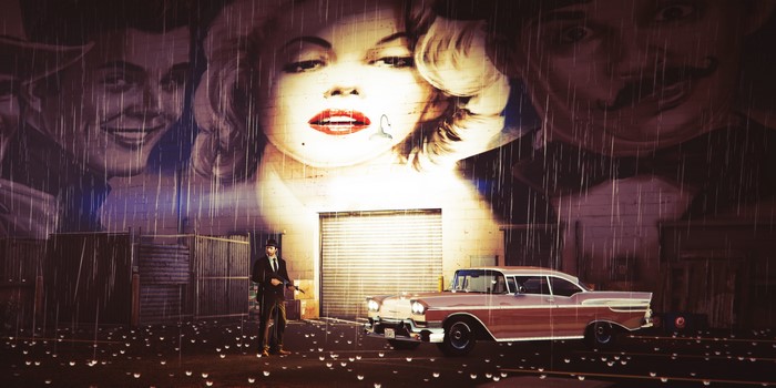 Man in suit with gun and vintage car in front of Marilyn Monroe mural