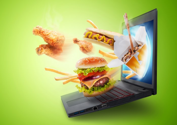 Fast food emerging from a laptop