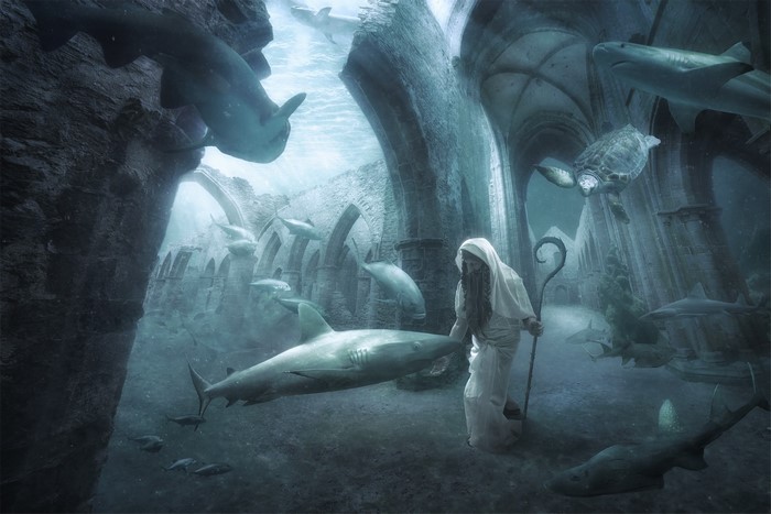 Underwater ruins with sharks, turtle, and a robed figure