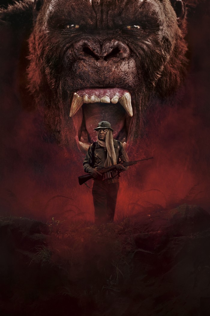 Man with rifle facing King Kong's roar