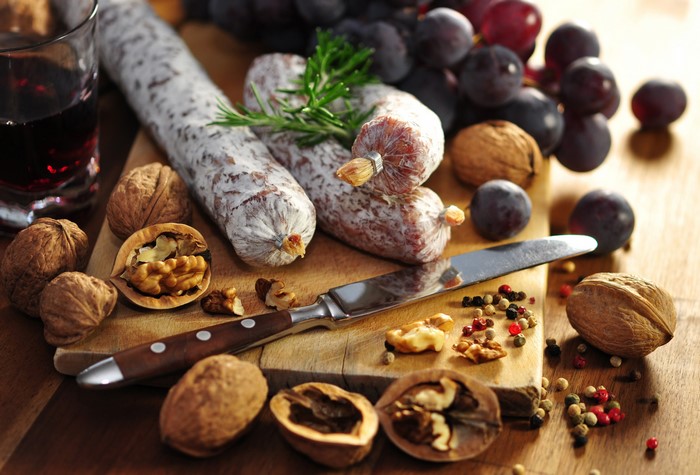 Sausage, Nuts, and Grapes on a Cutting Board