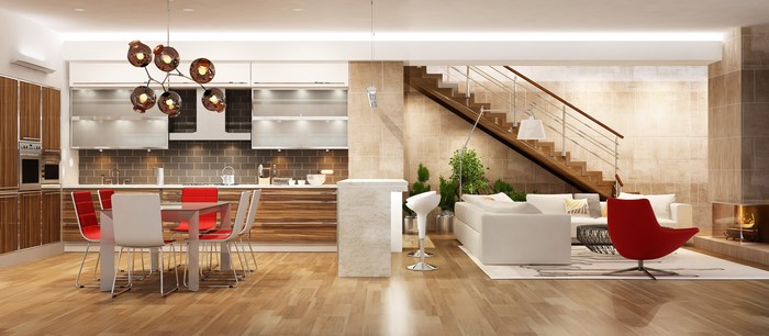 Modern open-plan living room and kitchen with stairs