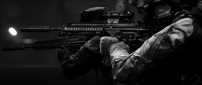 Soldiers with assault rifles and suppressors in black and white