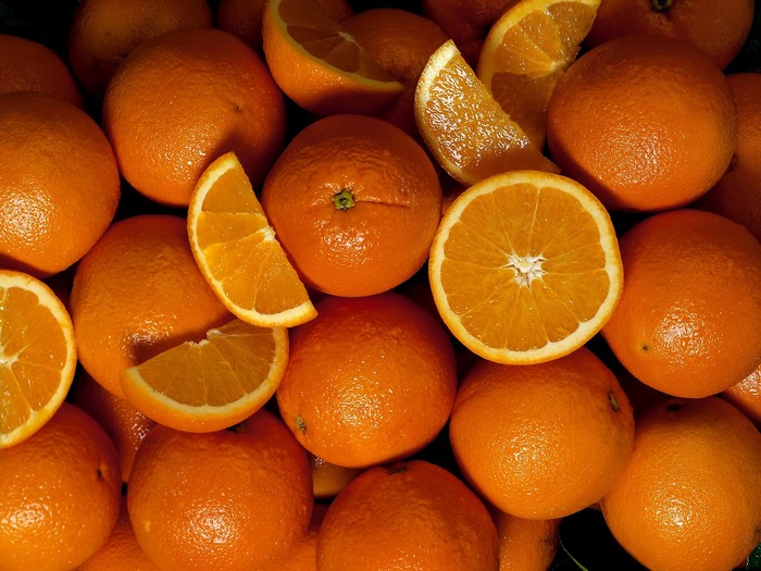 Pile of Oranges and Orange Slices