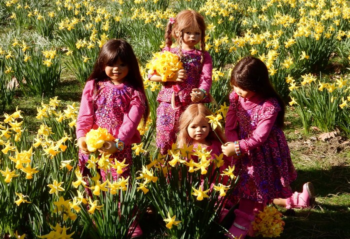 Dolls in a field of daffodils