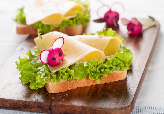 Cheese and lettuce sandwiches decorated with radish mice