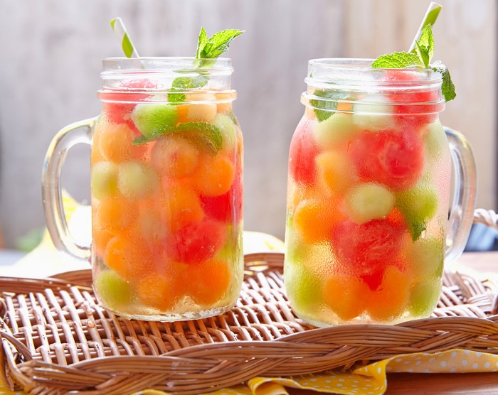 Two Fruit Infused Drinks in Mason Jars