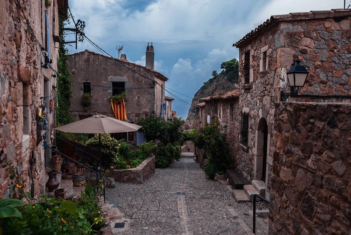 Cobblestone street in Tossa de Mar, Catalonia, Spain