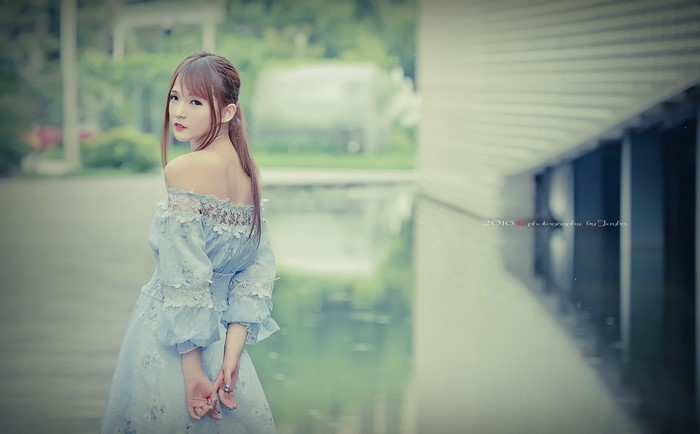Asian woman in a light blue dress