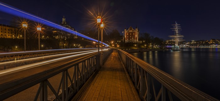 Stockholm Sweden Night Bridge with Light Trails and Tall Ship