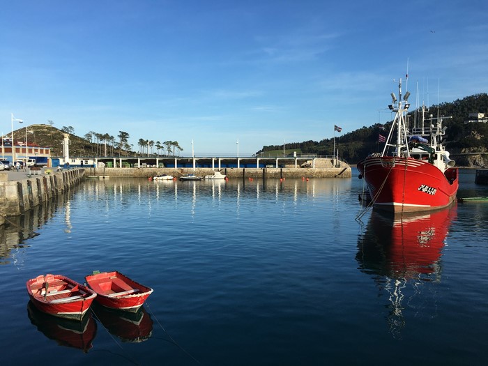 Red fishing boat in Lekeitio harbor, Spain