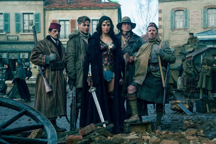 Wonder Woman and her companions in a town