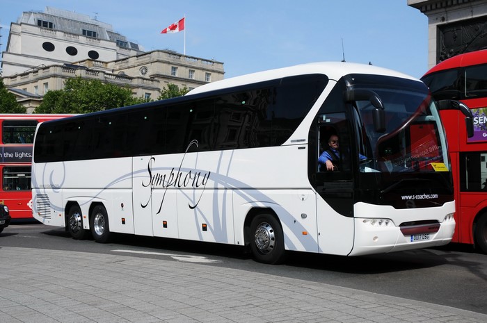 White NeoPlan Tourliner Bus with Symphony branding