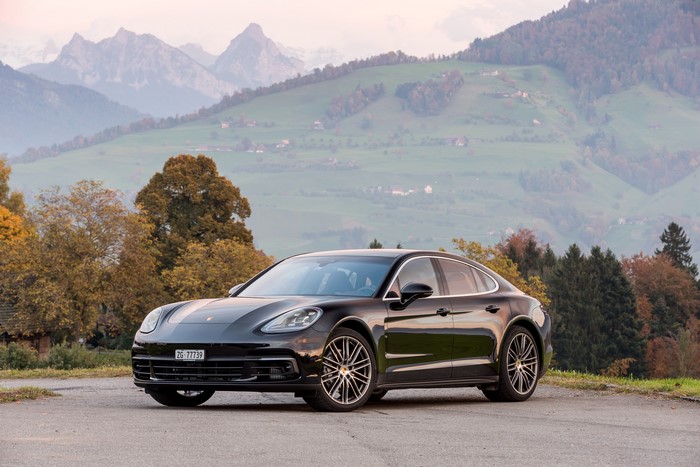 Black Porsche Panamera 4S in a mountainous landscape