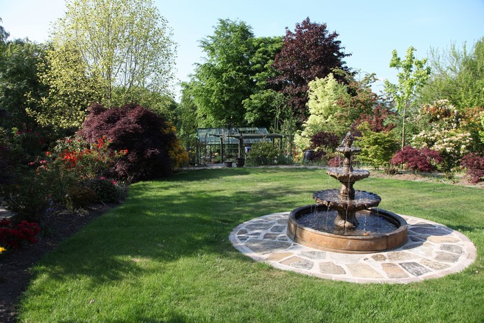 Garden with fountain and greenhouse