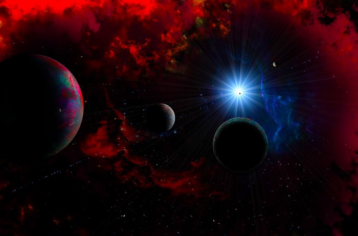 Planets and a bright star in a red nebula