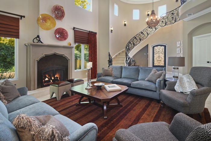 Living room with fireplace and spiral staircase