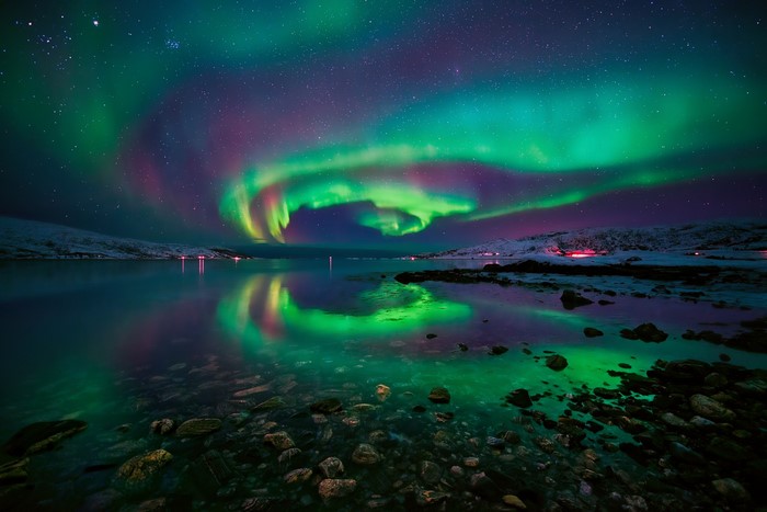 Aurora Borealis over a Fjord in Norway