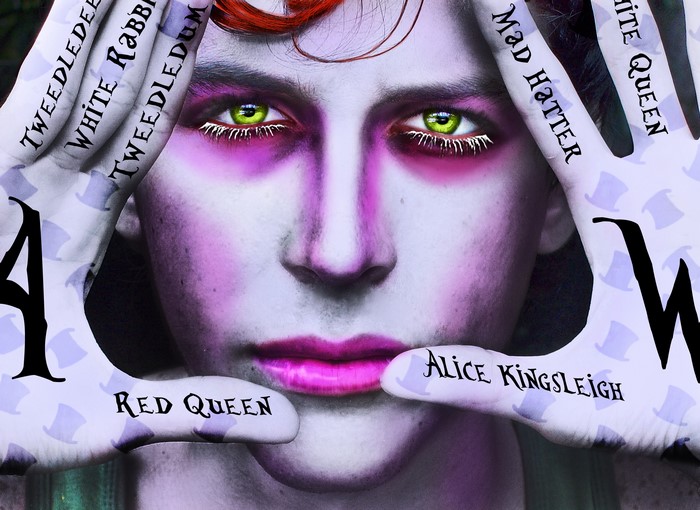 The Mad Hatter with Alice in Wonderland characters on hands