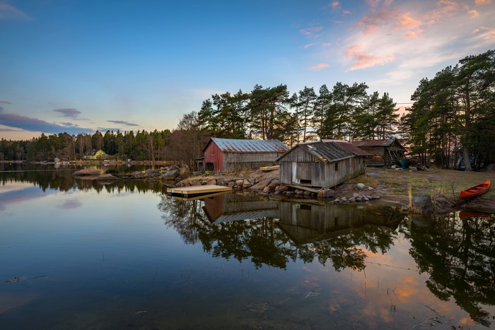 Boathouses on the coast of Mussalo Kotka, Finland at dusk