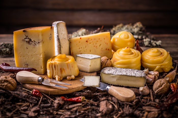 Assortment of Cheeses with Nuts and Peppers