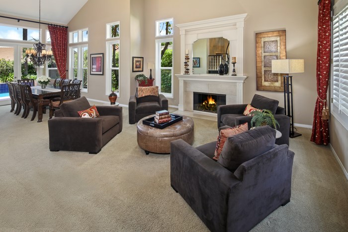 Living room with fireplace and dining area