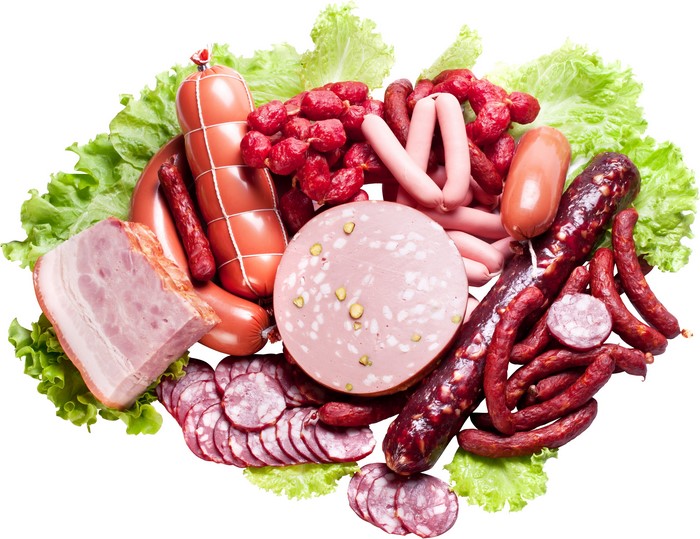 Assortment of sausages and meat products with lettuce