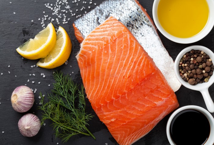 Salmon fillet with lemon, dill, garlic, and spices