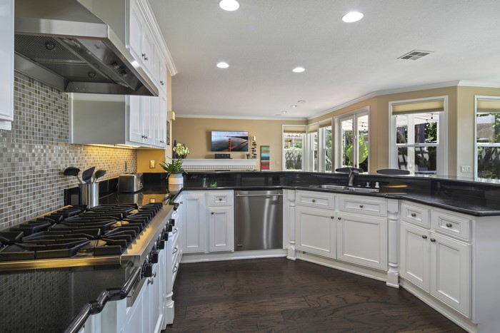 Modern Kitchen with Stainless Steel Appliances and Dark Countertops