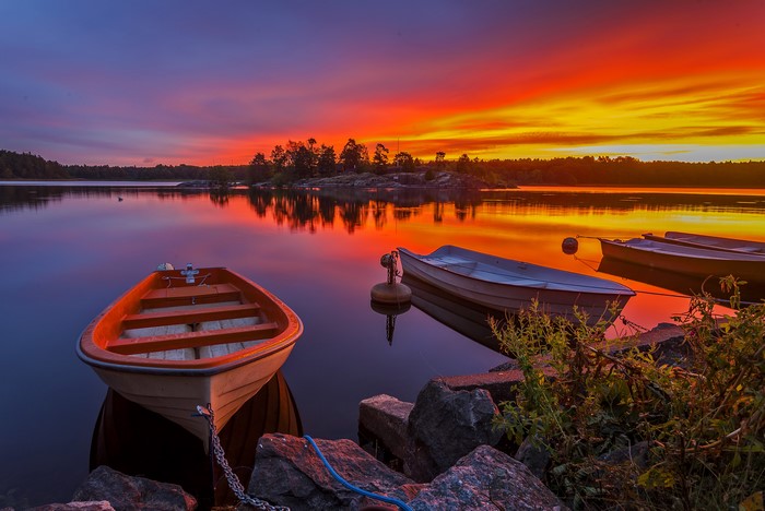 Boats on a lake at sunset in Sweden