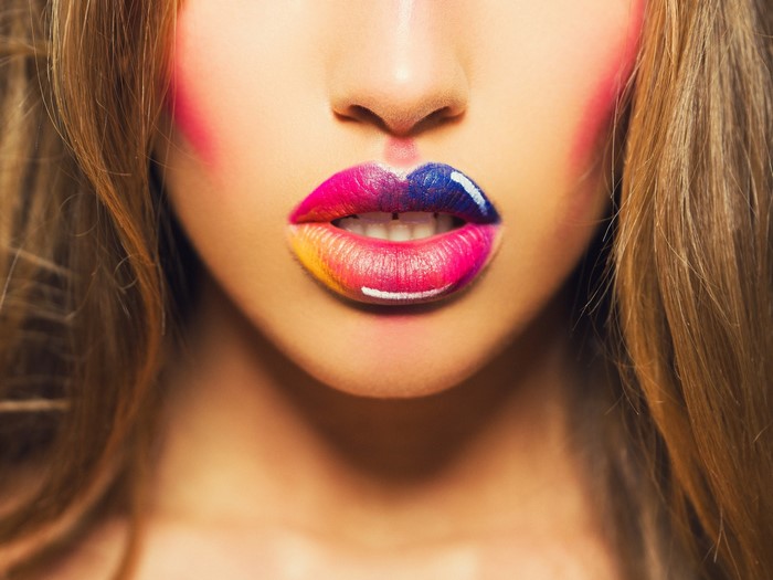 Woman with multicolor lips and makeup
