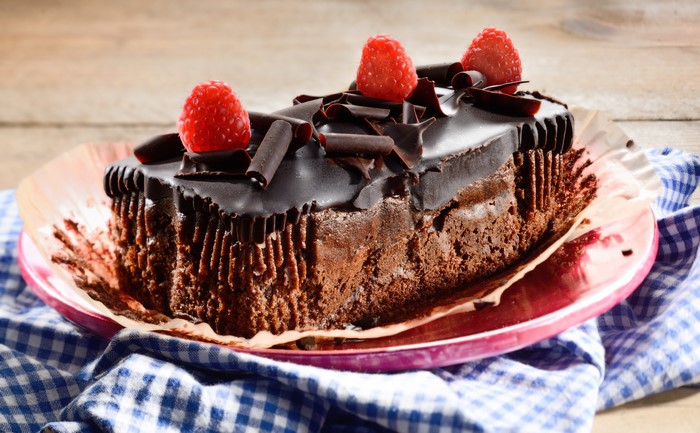Chocolate cake with raspberries on a plate