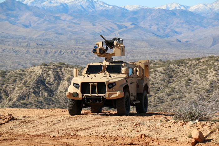 4K Oshkosh L-ATV military vehicle with machine gun